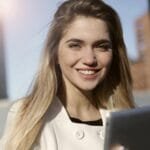 women smiling with tablet